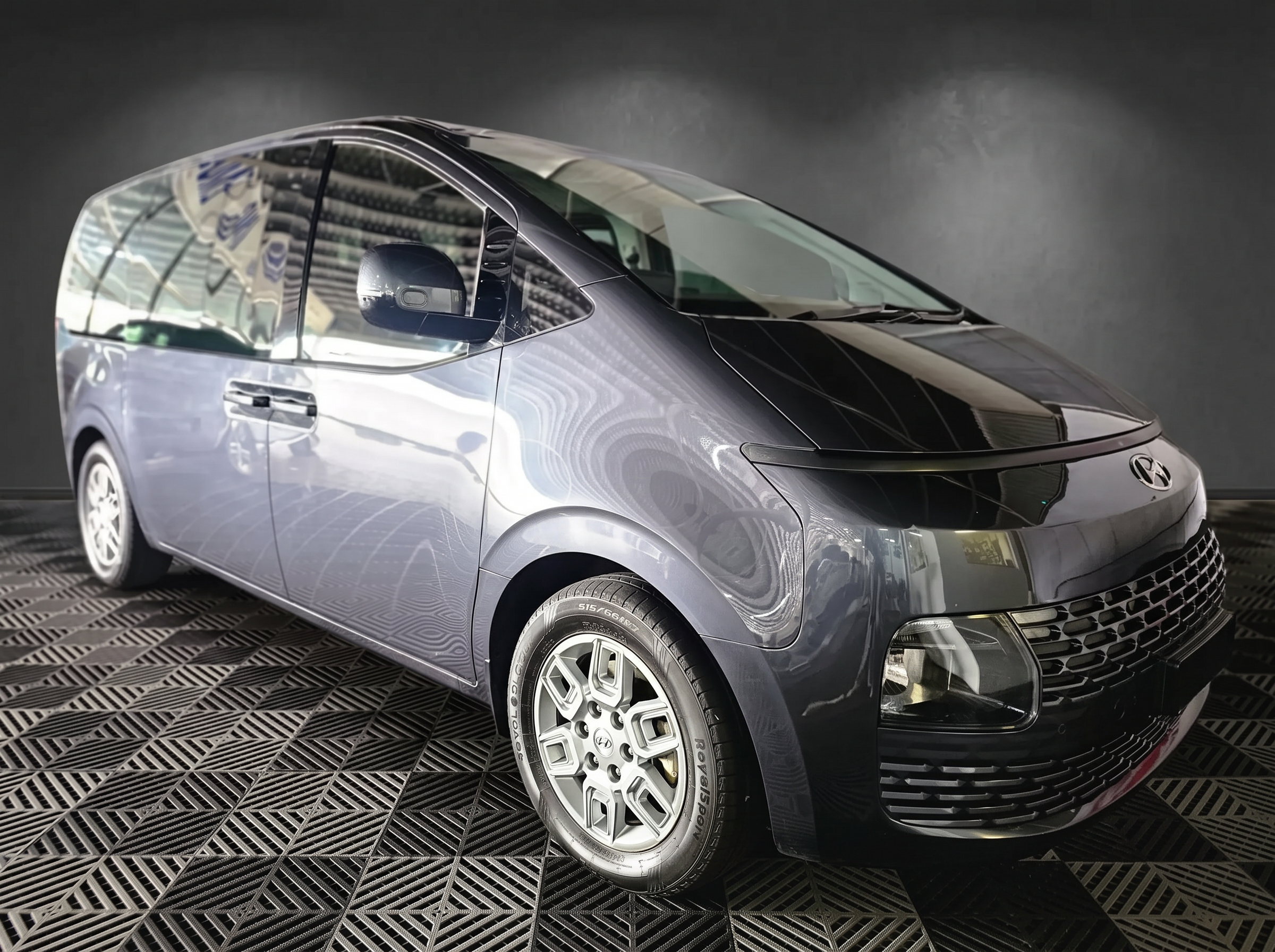 The dark grey Hyundai Staria, your private shuttle for the day